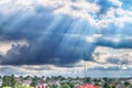 Beautiful view of sun rays through clouds and TV tower in Vinnytsia, Ukraine