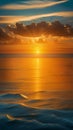 A beautiful view of the sun setting over the calm blue water of the ocean, creating a golden glow in the sky