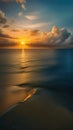 A beautiful view of the sun setting over the calm blue water of the ocean, creating a golden glow in the sky