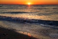 Beautiful view of sunrise in sea. Close Up of waves and beach at sea and colorful sky during sun rise, atmospheric moment. Sunset