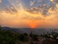 Beautiful view of the sunset and mountains from Sajjangad, satara, Maharashtra, India. Royalty Free Stock Photo