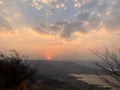 Beautiful view of the sunset and mountains from Sajjangad, satara, Maharashtra, India. Royalty Free Stock Photo