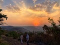 Beautiful view of the sunset and mountains from Sajjangad, satara, Maharashtra, India. Royalty Free Stock Photo