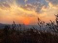 Beautiful view of the sunset and mountains from Sajjangad, satara, Maharashtra, India. Royalty Free Stock Photo