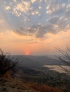 Beautiful view of the sunset and mountains from Sajjangad, satara, Maharashtra, India. Royalty Free Stock Photo