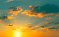 Beautiful view of a sunset sky with sun, sunrays and clouds. Nature background Royalty Free Stock Photo