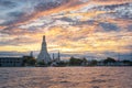 Sunset at Wat Arun with golden sky in Bangkok, Thailand. Royalty Free Stock Photo