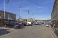 Beautiful view of Swedish and Finnish flags on waterfront in downtown Stockholm. Sweden. Royalty Free Stock Photo