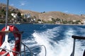 Beautiful view of the Symi island captured from a boat in Greece Royalty Free Stock Photo