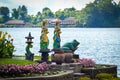 Beautiful View Of The Temple Garden With 2 Statues Of Goddess Ulun Danu On The Edge Of The Mountain Lake