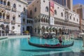 Beautiful view of territory of Venetian Hotel in Las Vegas with gondoliers and tourists on gondolas. Nevada,