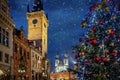 Beautiful view to the old town square of Prague with a christmas tree and with falling snow, Czech Republic Royalty Free Stock Photo