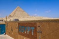 Beautiful View to the One of the Wonders of the Ancient World - Great Pyramids of Giza under Blue Sky and Day Lights of the Sun Royalty Free Stock Photo