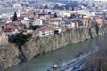 Beautiful view on top of the house on the edge of the cliff of the Kura river in Tbilisi Royalty Free Stock Photo