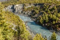 Beautiful view from top of mountains at river valley with wooden hunchbacked bridge Royalty Free Stock Photo