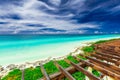 Beautiful view from the top of the roof on tropical white sand beach and tranquil turquoise tender ocean on sunny summer day