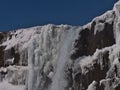 Top of ÃâxarÃÂ¡rfoss waterfall in rocky AlmannagjÃÂ¡ canyon in ÃÅ¾ingvellir national park, part of Golden Circle, Iceland, in winter.