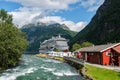 Beautiful view of the tourist ferry on Fjord Sea near the port in Geiranger village, Norway Royalty Free Stock Photo