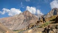 Beautiful view of a tourist taking shot of a mountain under the blue sky