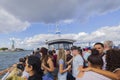 Beautiful view of tourists on sightseeing boat near Brooklyn Bridge overlooking Statue of Liberty. New York, USA. Royalty Free Stock Photo