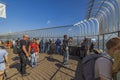 Beautiful view tourists on 86th floor observation desk of Empire state building. New York,