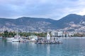 Beautiful view on a town, mountains, sea, lighthouse and ships in Alanya port, Turkey Royalty Free Stock Photo