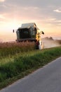 Beautiful view of a tractor during the reaping of the wheat fields Royalty Free Stock Photo