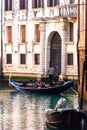 Gondola and gondolier on famous Venice canals