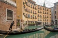 Beautiful view of traditional Gondolas with tourist on famous Canal Grande in Venice, Italy