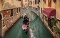 Beautiful view of traditional Gondolas with tourist on famous Canal Grande in Venice, Italy