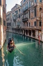 Beautiful view of traditional Gondolas with tourist on famous Canal Grande in Venice, Italy