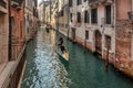 Beautiful view of traditional Gondolas with tourist on famous Canal Grande in Venice, Italy