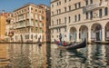 Beautiful view of traditional Gondolas with tourist on famous Canal Grande in Venice, Italy