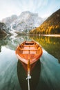 Traditional rowing boat at Lago di Braies at sunrise in fall, South Tyrol, Italy Royalty Free Stock Photo