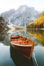 Traditional rowing boat on a lake in the Alps in fall Royalty Free Stock Photo