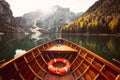 Traditional rowing boat on a lake in the Alps in fall Royalty Free Stock Photo