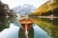 Traditional rowing boat on a lake in the Alps in fall Royalty Free Stock Photo