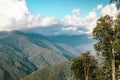 Beautiful view of the trees and mountains with big clouds in blue sky. Krasnodar area, Sochi Royalty Free Stock Photo