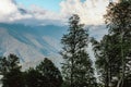 Beautiful view of the trees and mountains with big clouds in blue sky. Krasnodar area, Sochi Royalty Free Stock Photo