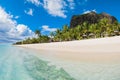 Beautiful view of tropical beach on Mauritius. Transparent ocean, sand, palms and blue sky Royalty Free Stock Photo