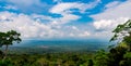 World heritage. Green dense tall trees on the mountain and blue sky and cumulus clouds. Royalty Free Stock Photo