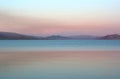 Beautiful view of the turquoise and pink water of lake on the sunset in Kazakhstan Royalty Free Stock Photo