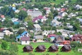 A beautiful view of the village of Mezhgorye, Carpathian region. A lot of residential buildings surrounded by high forest mountain Royalty Free Stock Photo