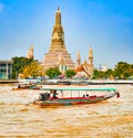 Beautiful view of War Arun from the river. Boat on the foreground. Bangkok, Thailand