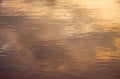 Water surface at sunset golden abstract background Royalty Free Stock Photo