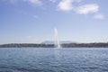 Beautiful view of the water jet fountain in the lake of Geneva, Switzerland. Geneva cityscape with its famous Jet d`Eau Royalty Free Stock Photo