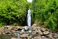 Beautiful view of a waterfall located along famous Road to Hana on Maui island, Hawaii Royalty Free Stock Photo