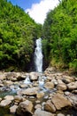 Beautiful view of a waterfall located along famous Road to Hana on Maui island, Hawaii Royalty Free Stock Photo