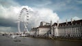 Beautiful view of waterfront with ships and Ferris wheel. Action. Waterfront landscape with beautiful European