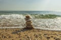 Beautiful view of waves oncoming on composition of stones.